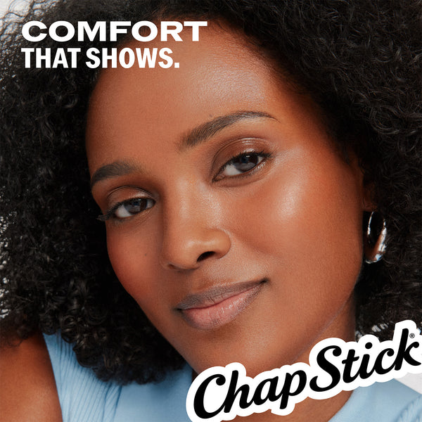 Person holding ChapStick classic medicated lip balm near face with ChapStick logo