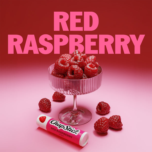 Red raspberry lip balm stick with raspberry fruit graphic