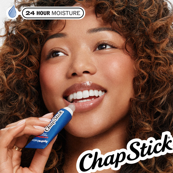 Lip balm applied to lips with blue stick applicator